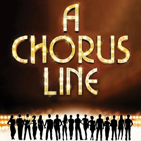 Bright marquee sign spelling "Chorus Line" above a row of silhouetted dancers or performers.