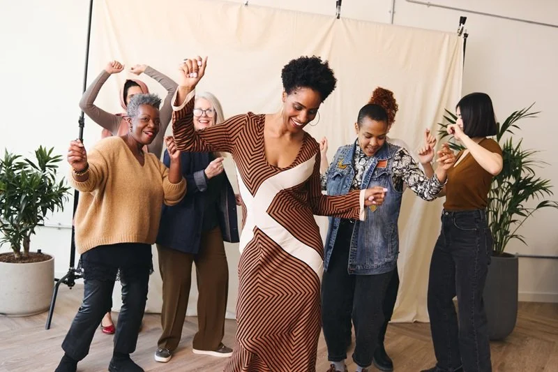 diverse group of women dancing and having fun