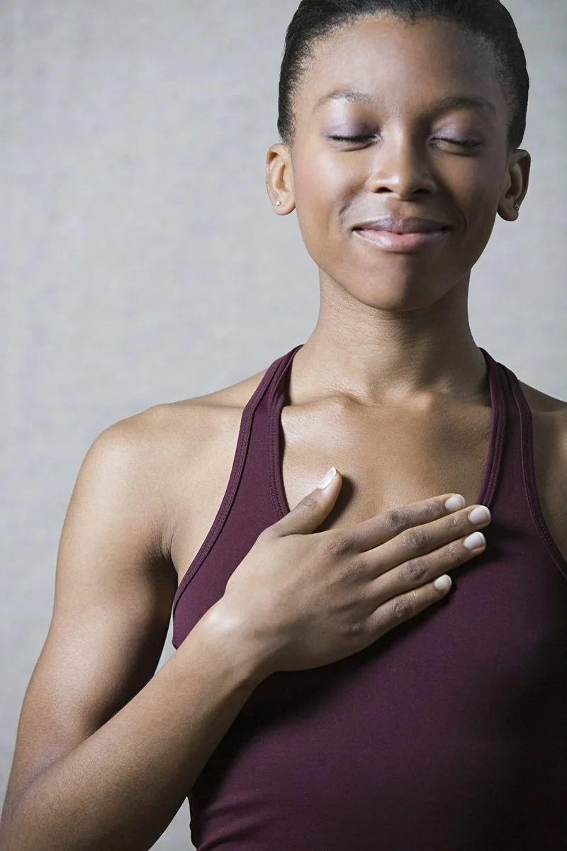 woman taking a moment to breathe deeply