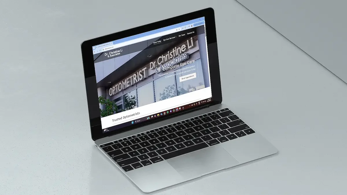 Laptop displaying an engaging website for Dr. Christine Li & Associates, an optometry practice, with a focus on quality eye care services.