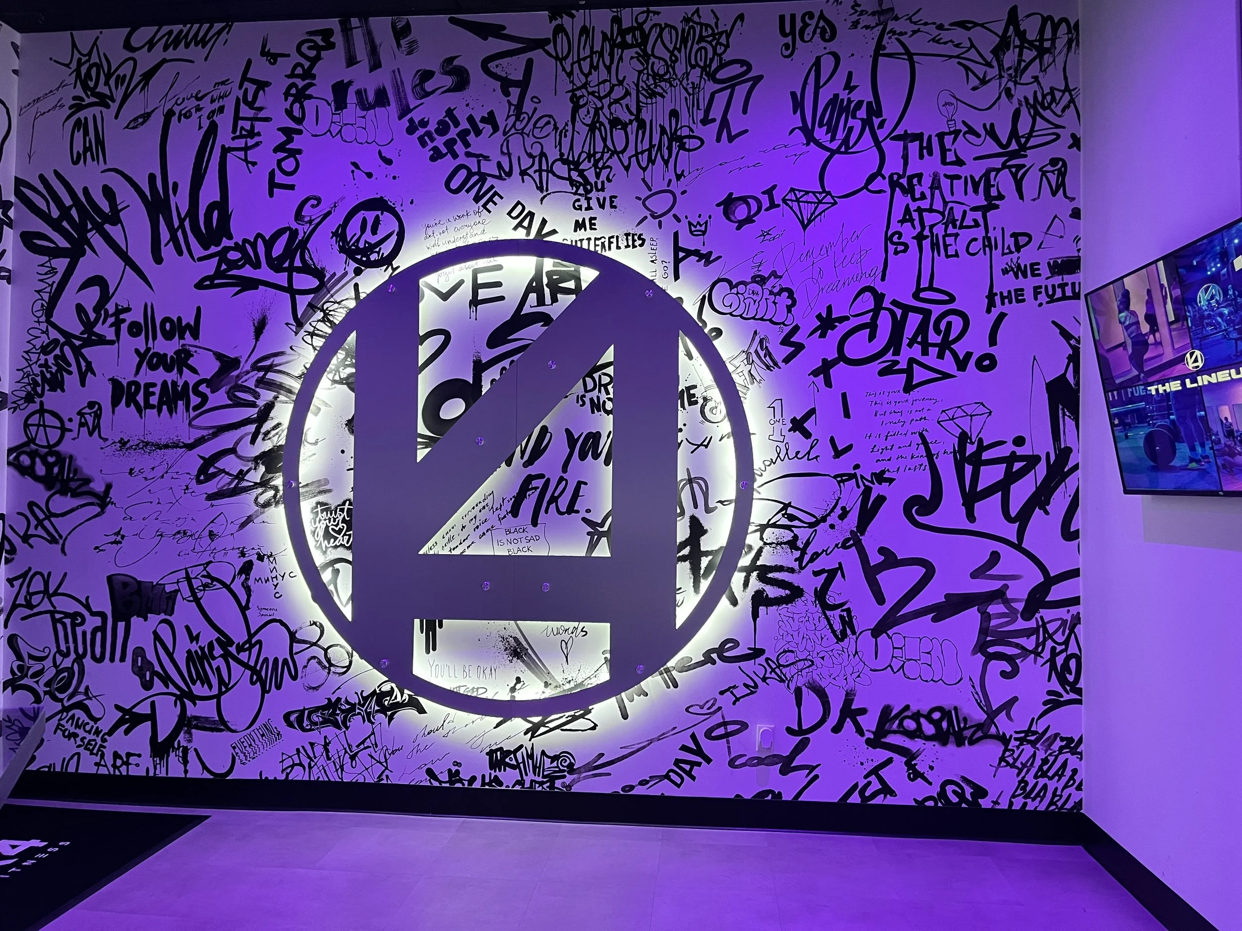 Custom signs displayed outside Greenville, SC business storefront entrance