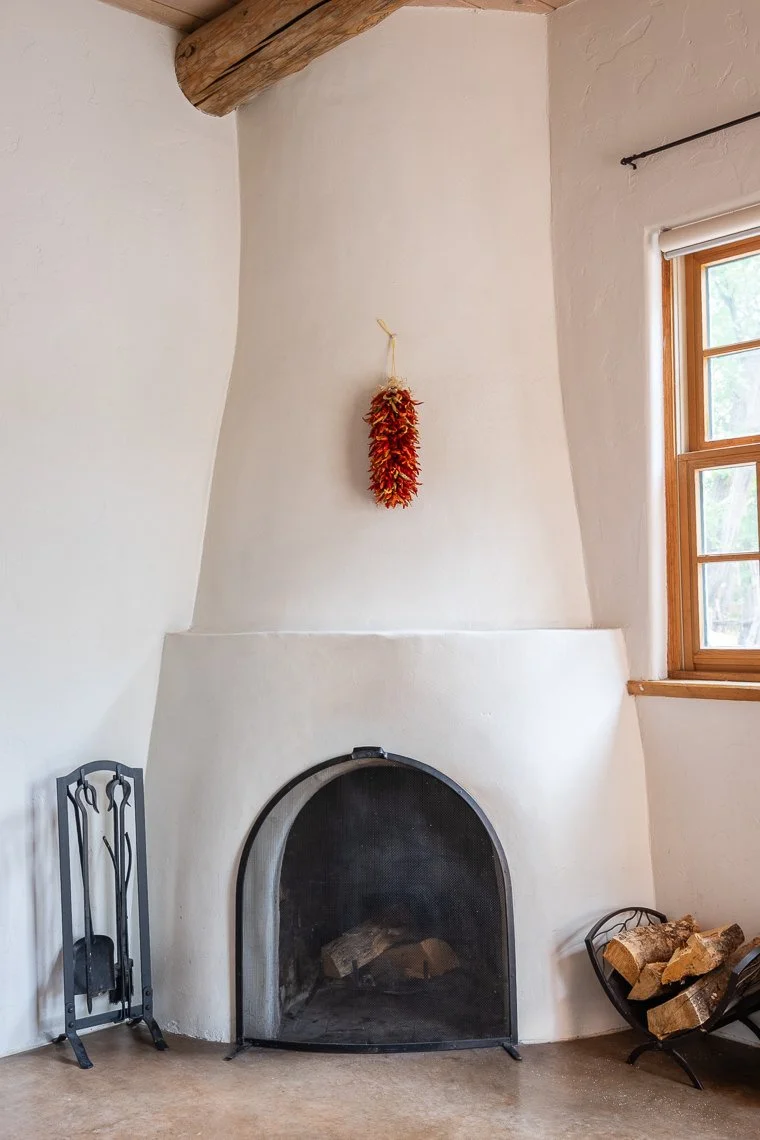 Living room real estate photography featuring a fireplace in a Santa Fe, New Mexico home