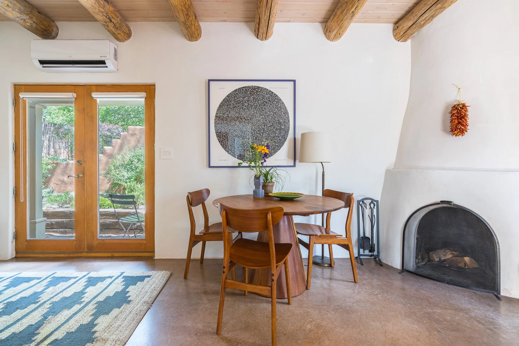 Living room real estate photography featuring a fireplace in a New Mexico adobe home
