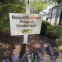 Sign that says 'Beautification Project Underway' with a logo for ResiPro and trees in the background.