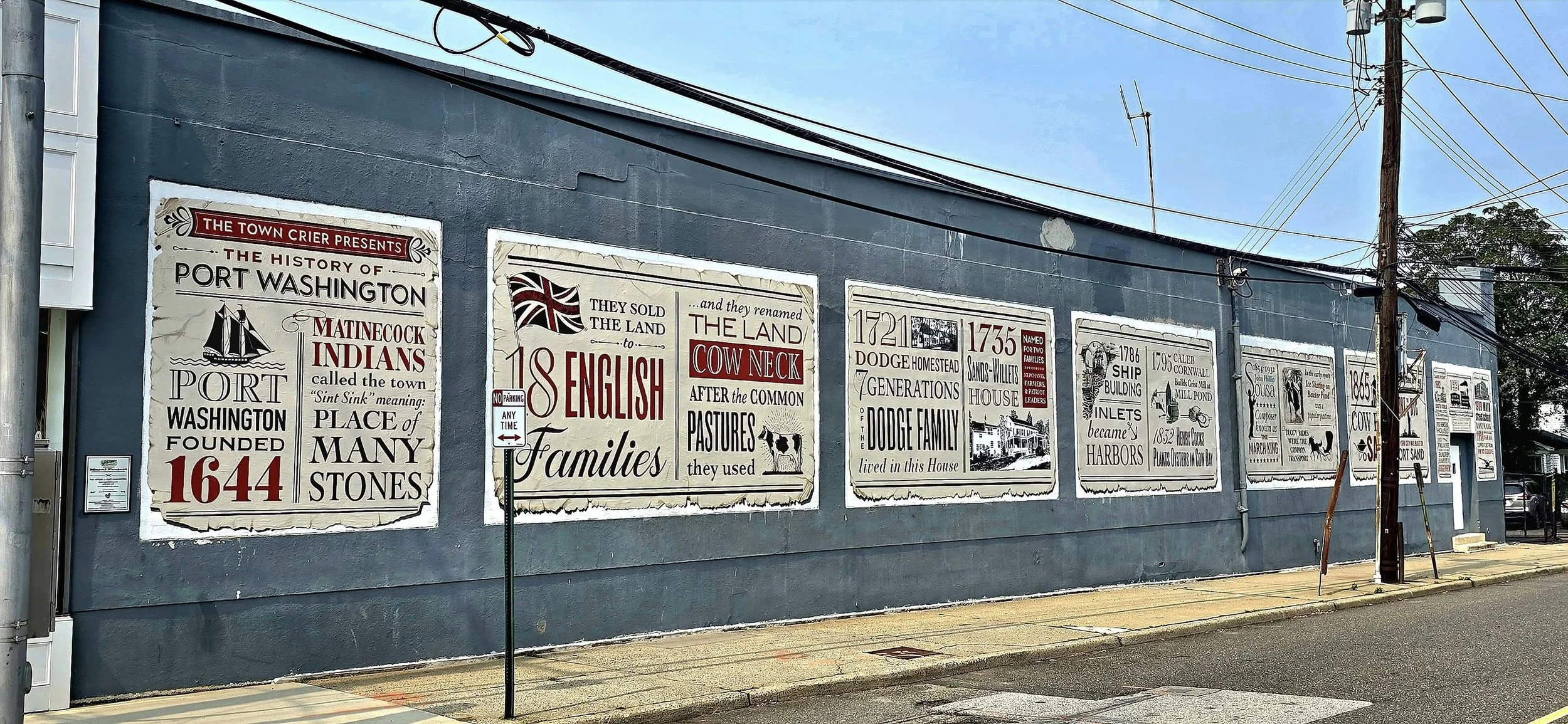 A mural on a building wall featuring historic information about Port Washington, including stories of early settlers, Native Americans, and local landmarks. The mural contains various text sections, historical images, and decorative elements.
