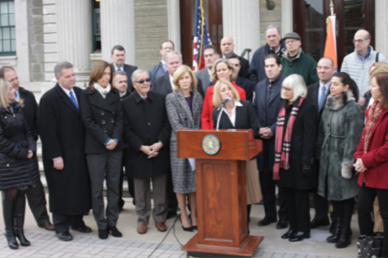 Residents Forward advocates standing in front of a podium to discuss for our local water systems.
