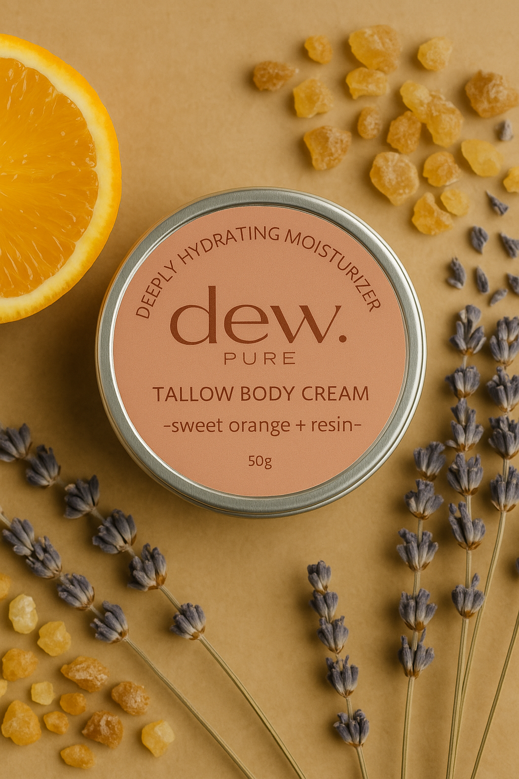 A tin of dew. Pure Tallow Body Cream with sweet orange and resin, surrounded by a half orange, lavender sprigs, and yellow resin crystals on a beige background.