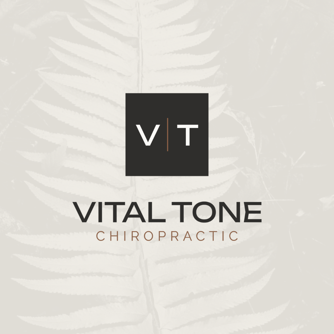 Logo for Vital Tone Chiropractic with a black square containing white letters V and T separated by a line, background of faint fern leaves. Vital Tone Chiropractic used Core Identity's Launch Package to develop a cohesive brand for their company.