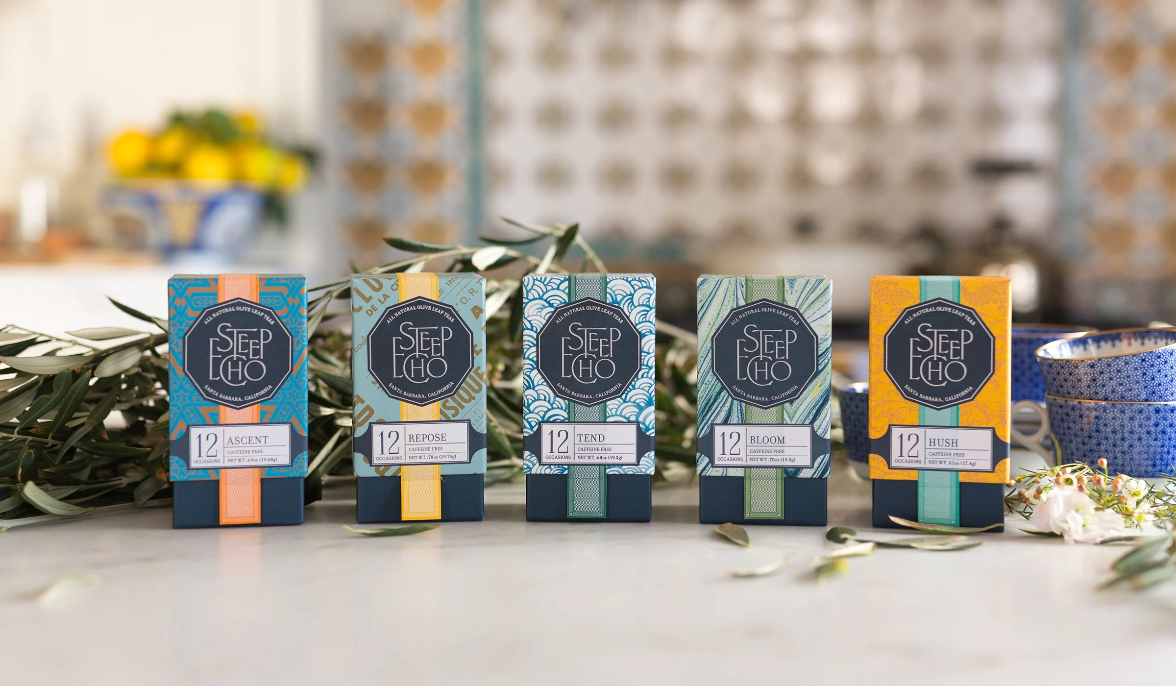 Steep Echo tea packaging design featuring a colorful product lineup with patterned boxes and botanical lifestyle setting