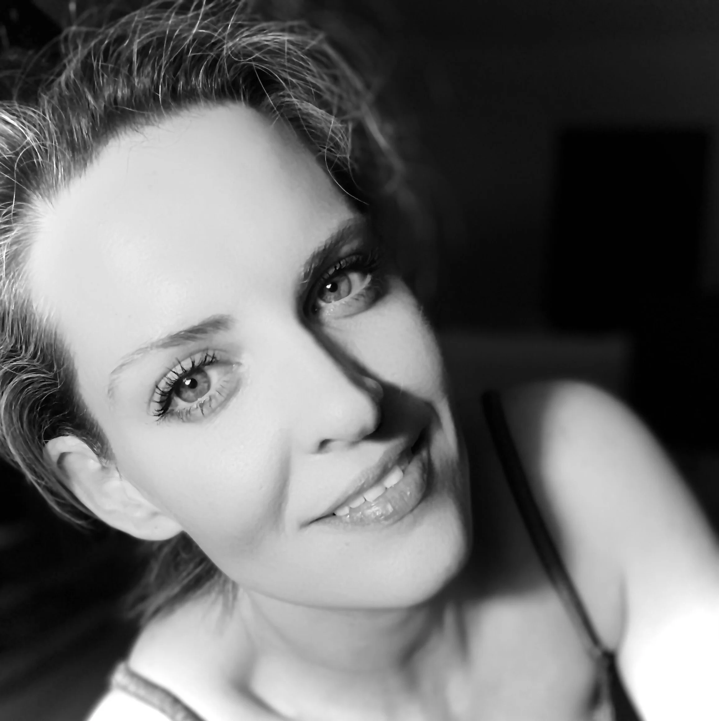 Black and white portrait of Tarah S., certified sexologist and intimacy educator