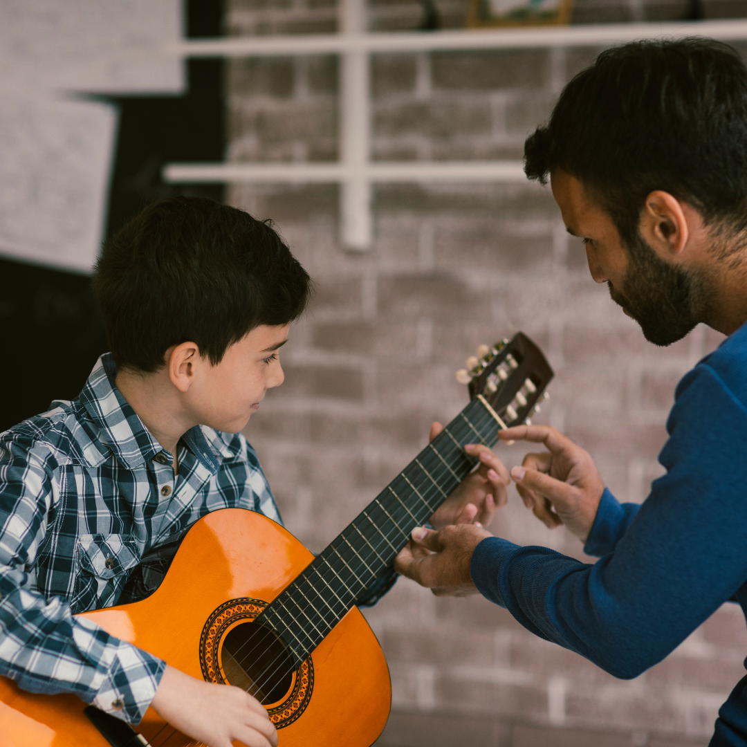 Los Angeles Music Teachers acoustic guitar lesson in-home learning first songs and transitions