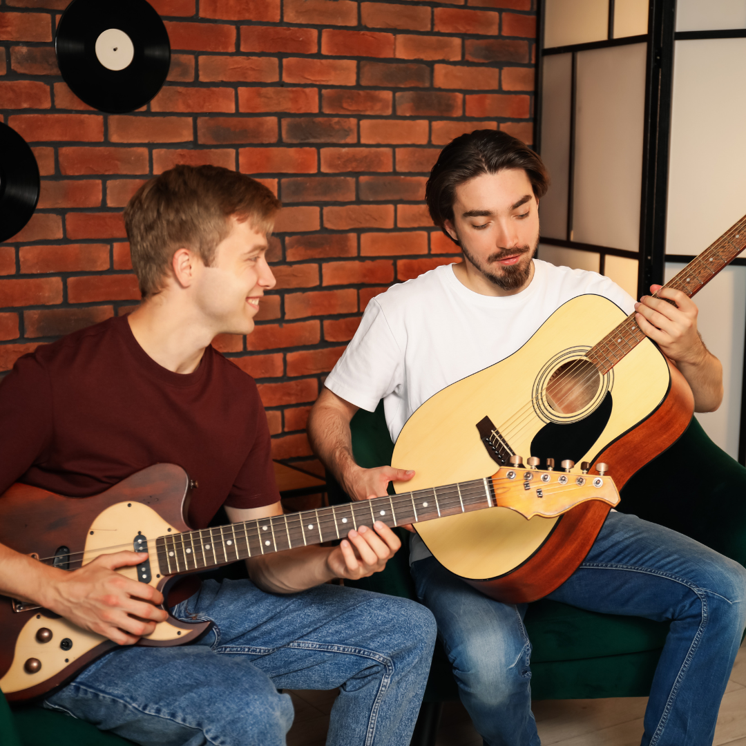 Los Angeles Music Teachers guitar teacher helping beginner with finger placement and posture