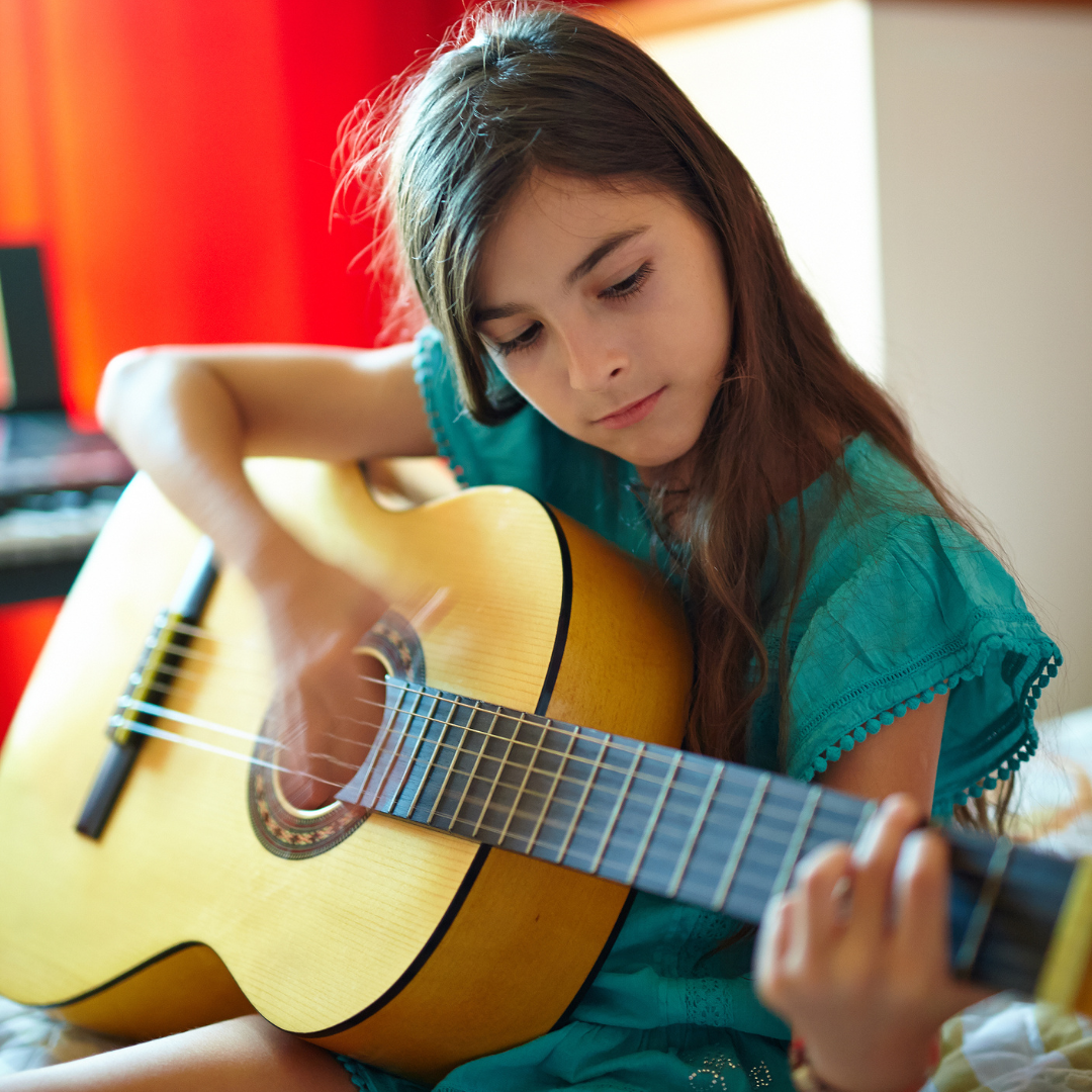 Los Angeles Music Teachers guitar lesson in-home student practicing chords with instructor