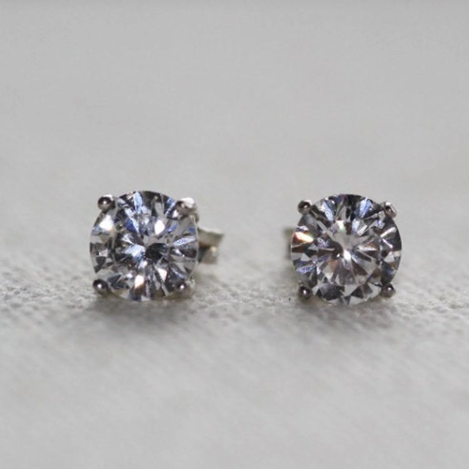Handcrafted platinum diamond stud earrings with push back, screw back, and flat back options