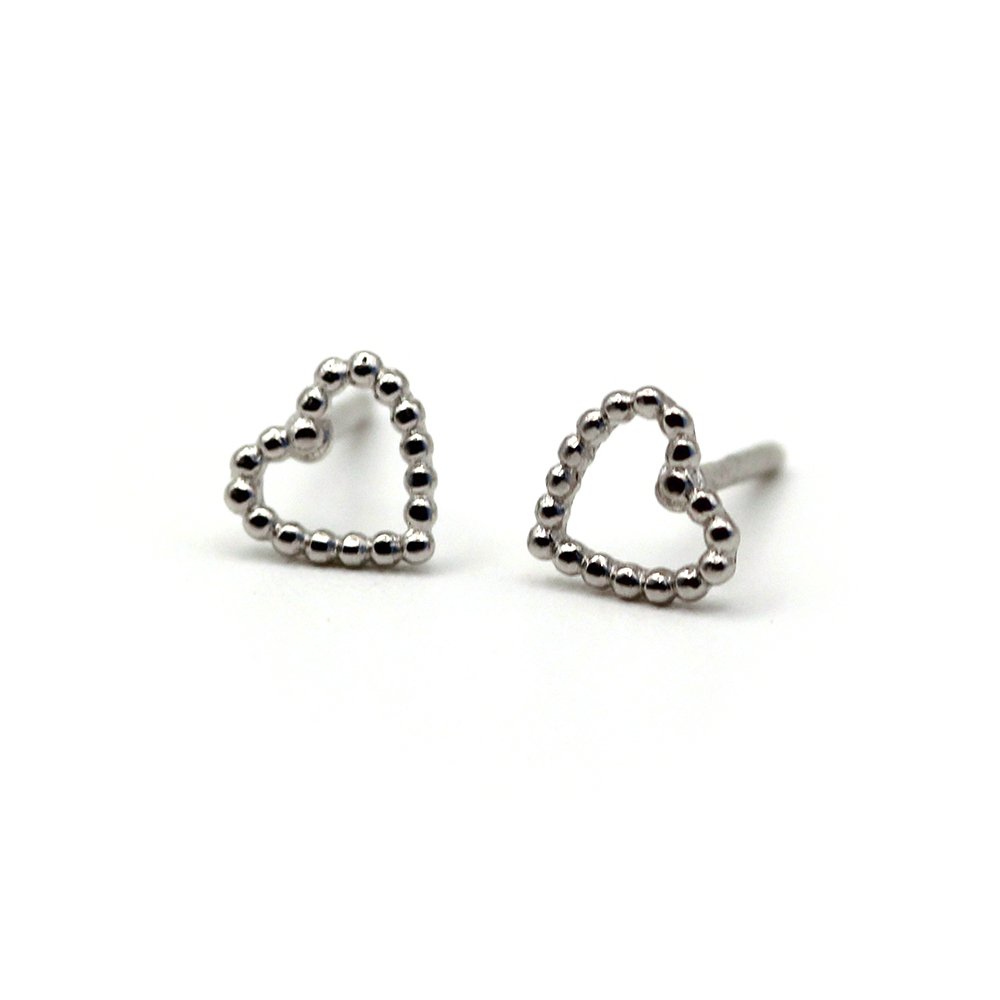 Fall in love with our 14K Tiny Bubble Cute Heart Gold Earrings. Solid gold, lightweight, and handcrafted with a textured heart design. Perfect for daily wear and gifts.