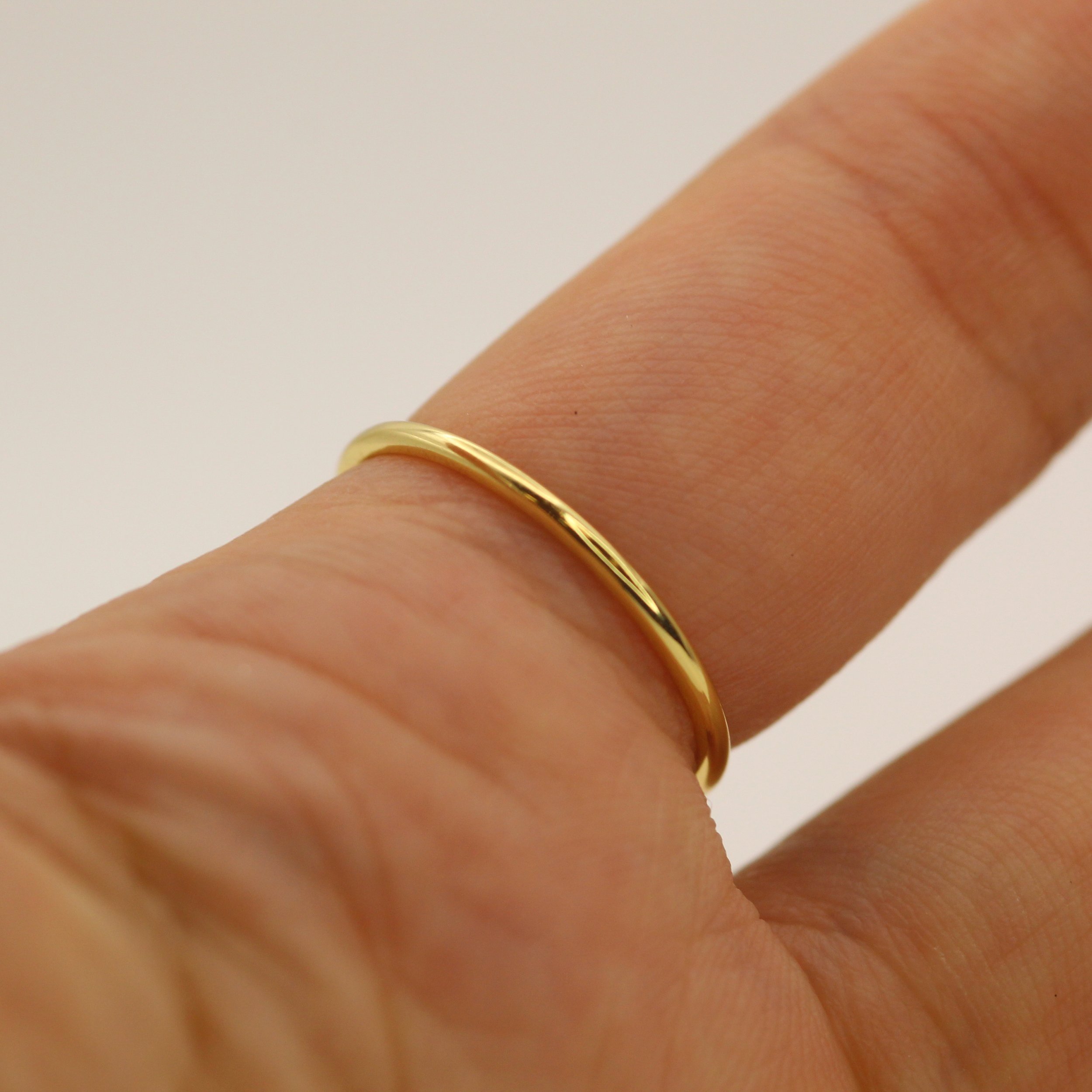 Discover the 14K Simple Thin Gold Ring from VicStoneNYC Jewelry. A timeless, stackable piece handcrafted in solid gold. Everyday elegance redefined. (Copy)