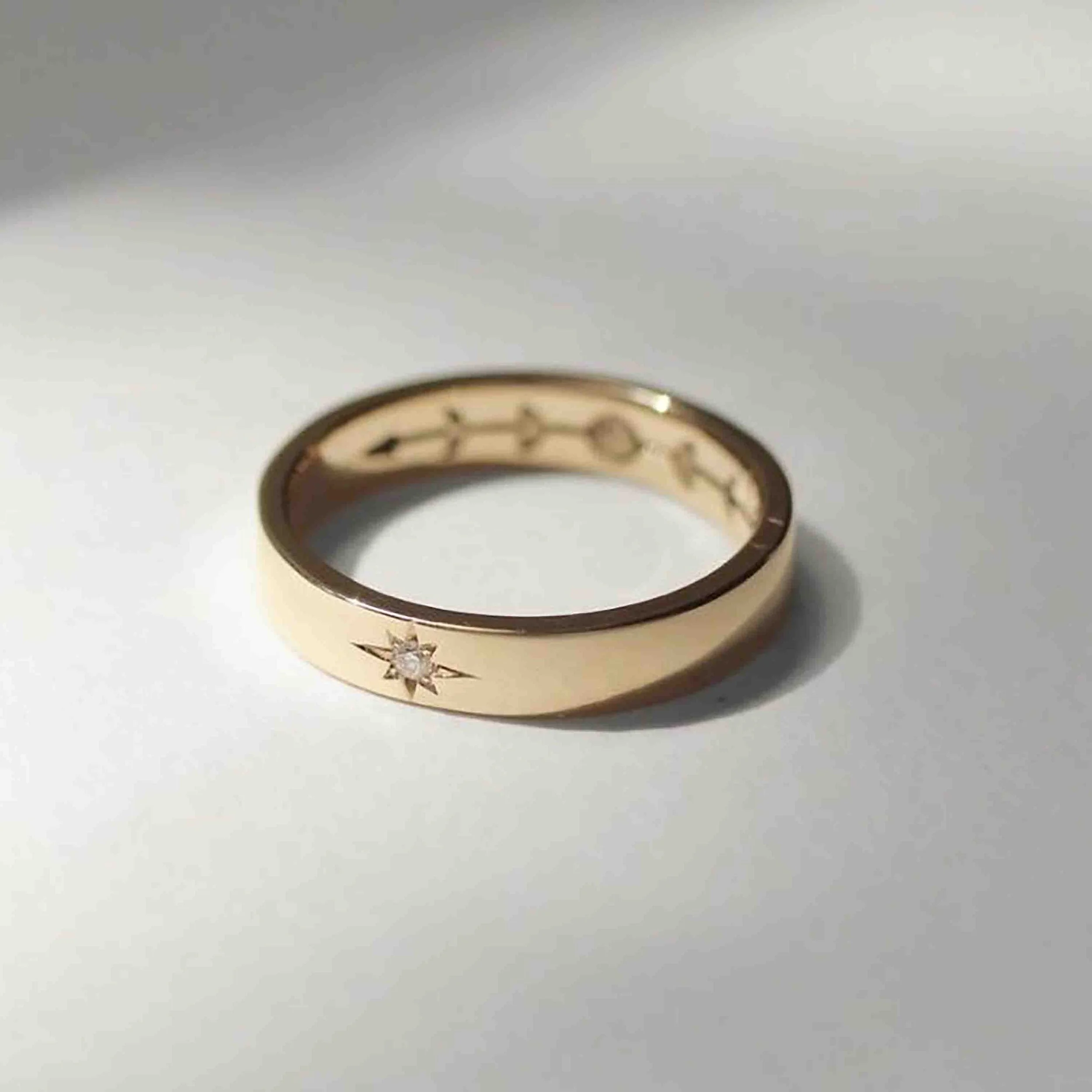 unisex gold ring with engraved moon phases and diamond star (4).jpg