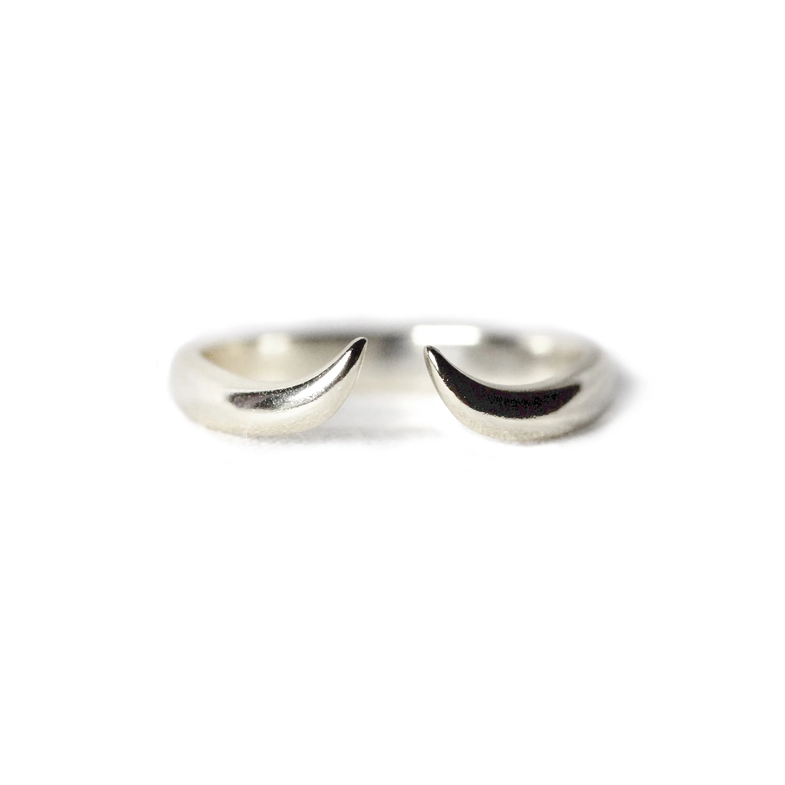 A handcrafted 14K Yellow Gold Horn Cuff Ring designed by VicStoneNYC, photographed against a minimal backdrop to highlight its bold curves and elegant shine.