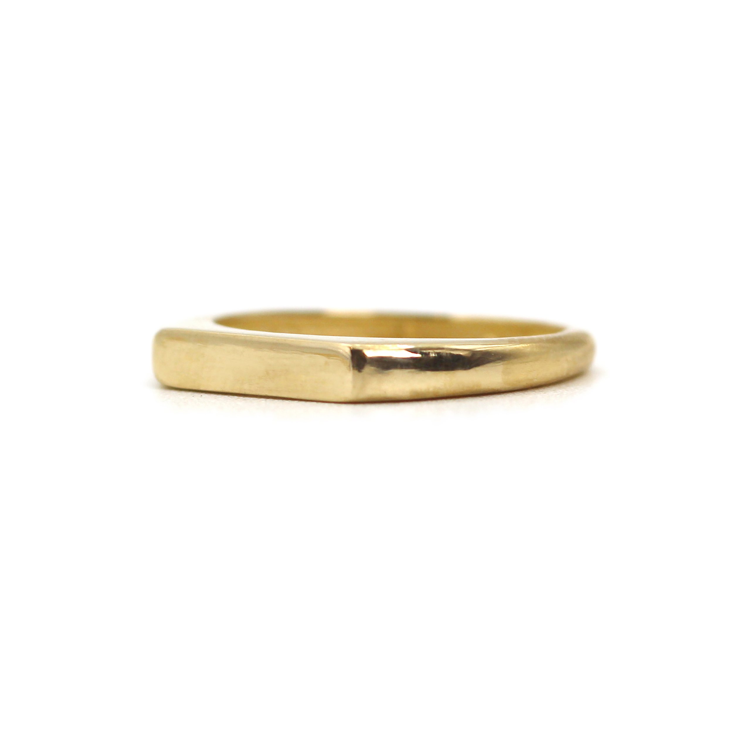 Discover the 14K Signet Bar Gold Ring – a sleek, handcrafted gold ring with a modern bar design. Perfect for everyday wear or gifting. Made in NYC.