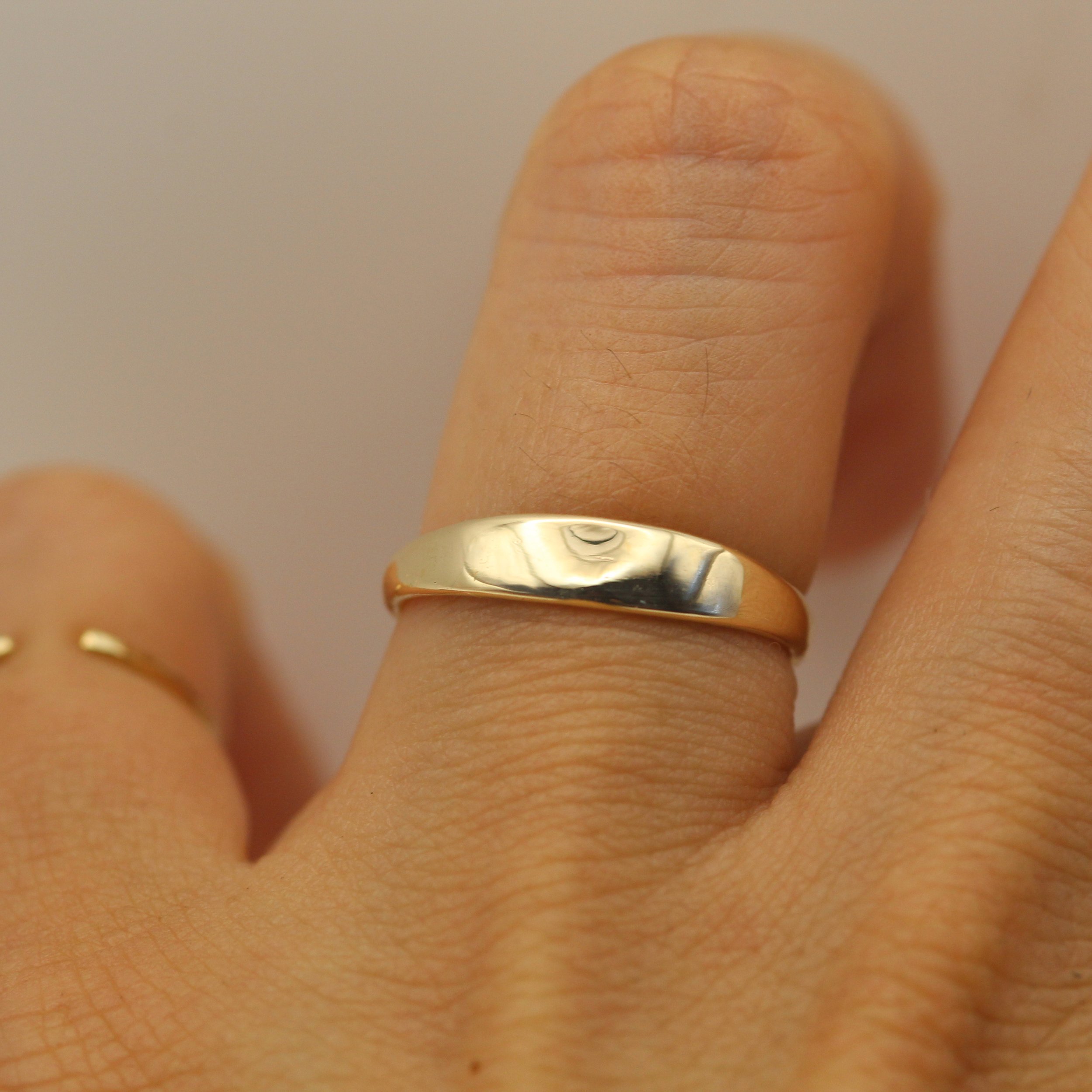 Modern gold ring with flowing silhouette, handcrafted for daily wear