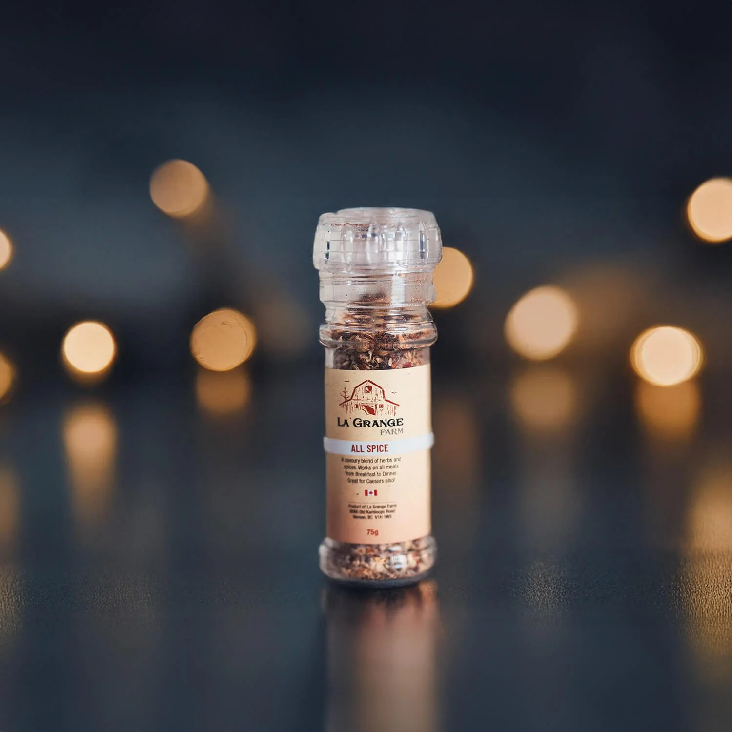 La Grange Farm allspice jar with bokeh lights in the background.
