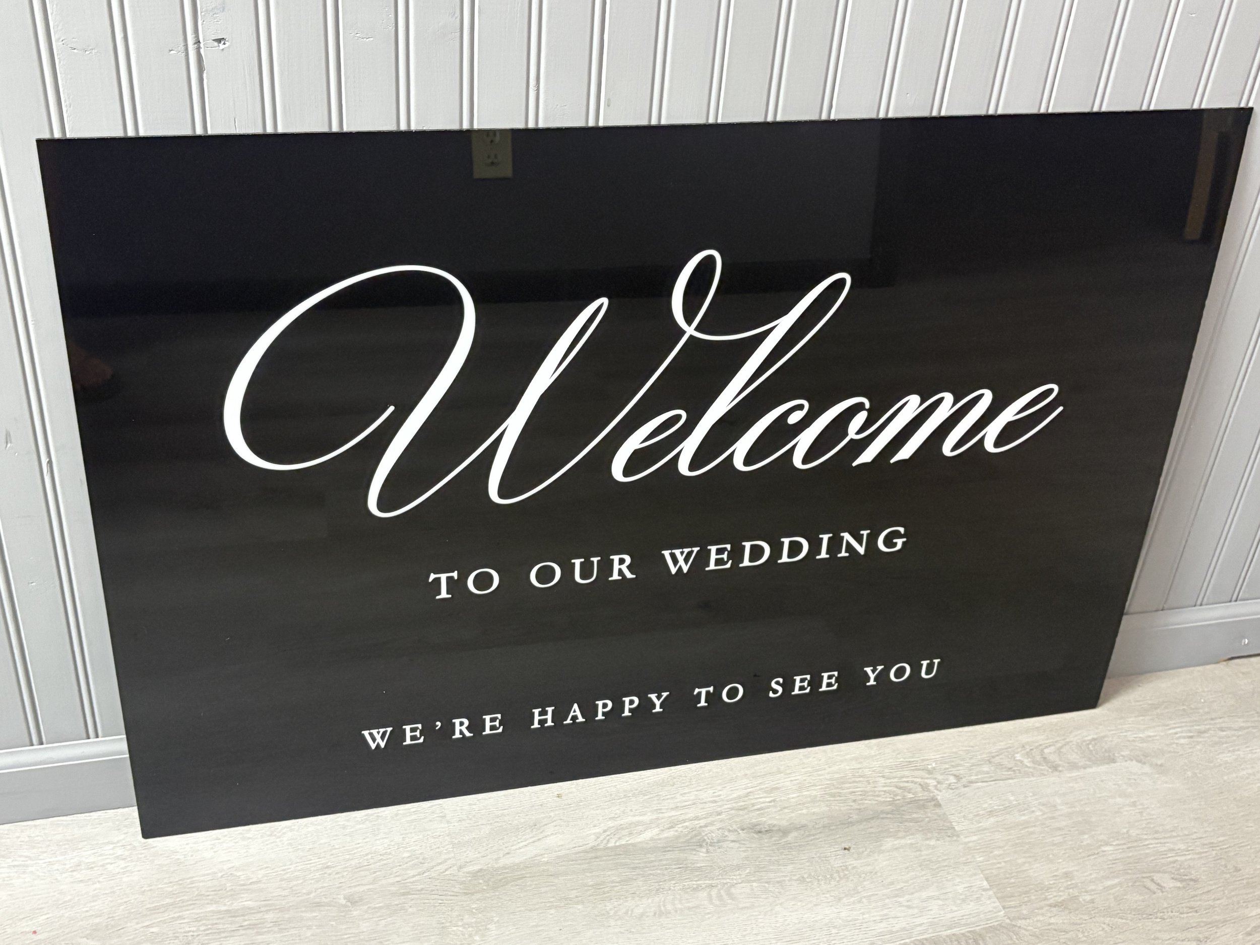 Black acrylic welcome sign
