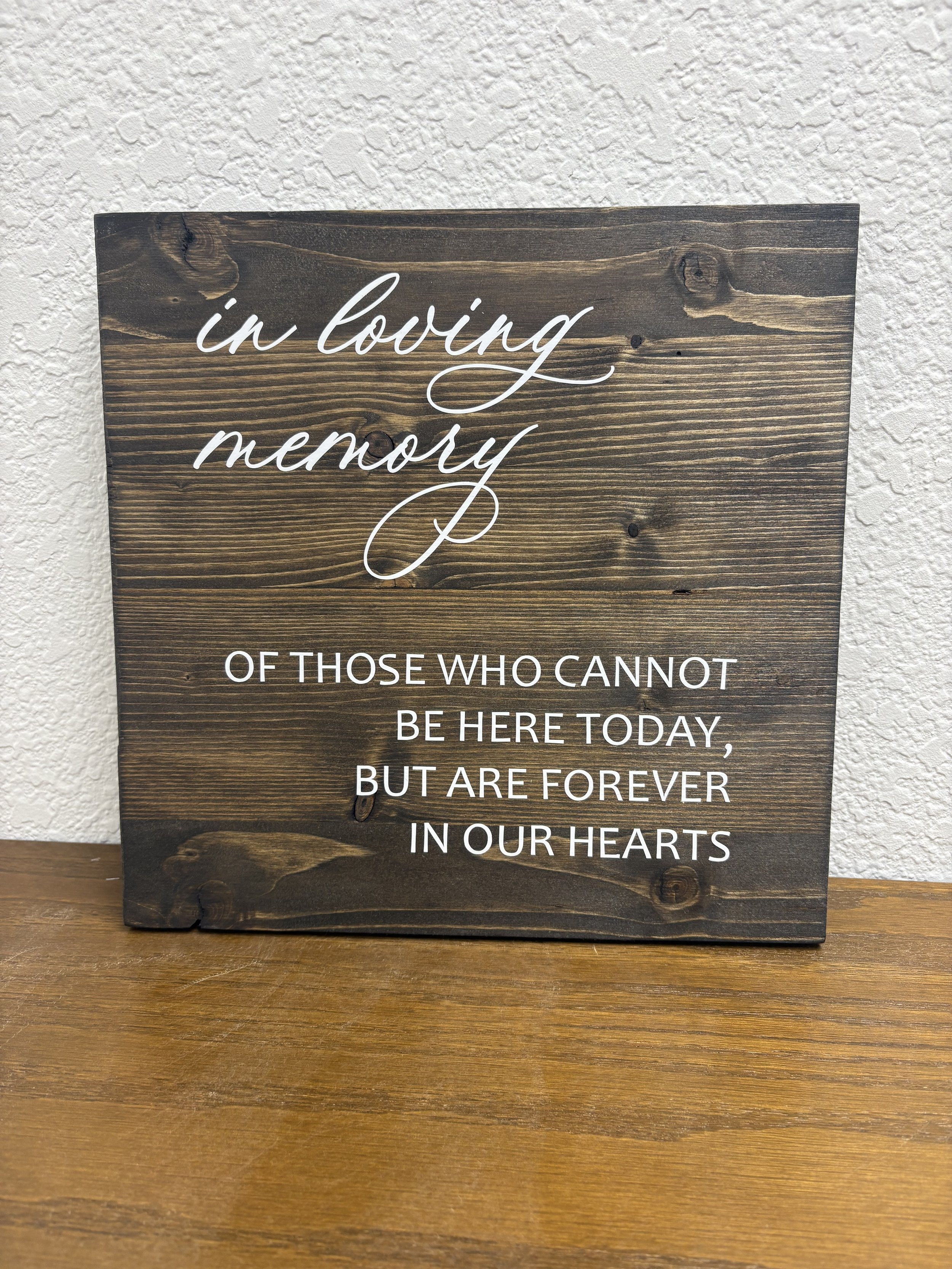 dark wood memorial sign