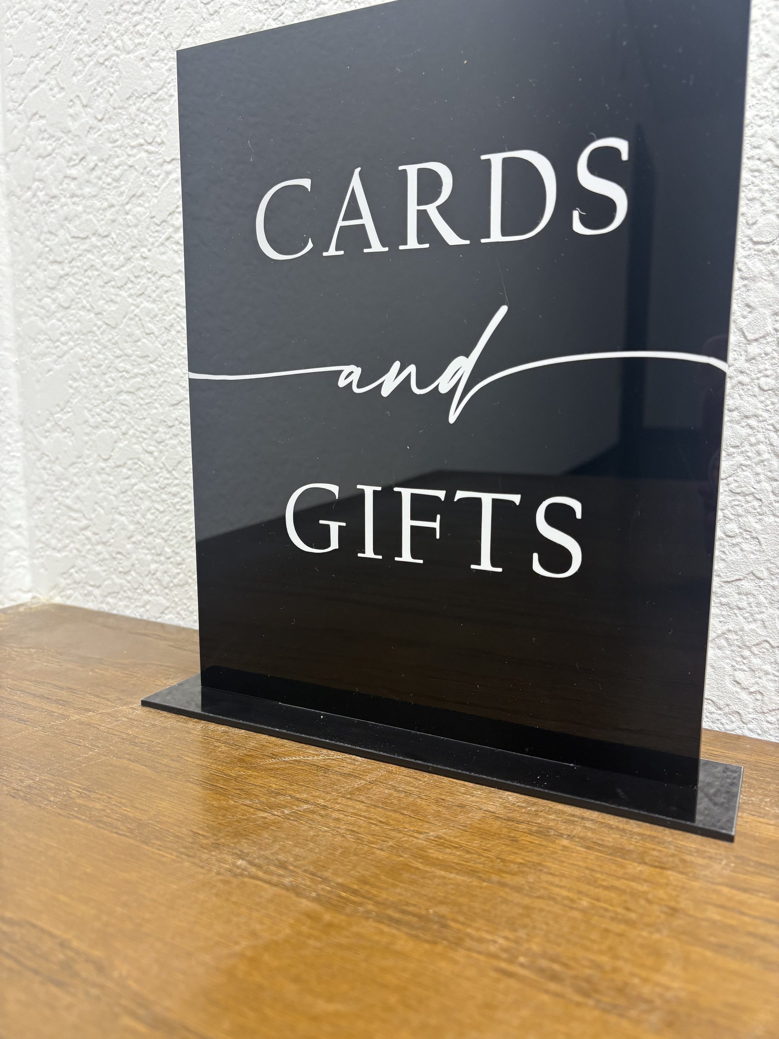 black cards and gifts sign