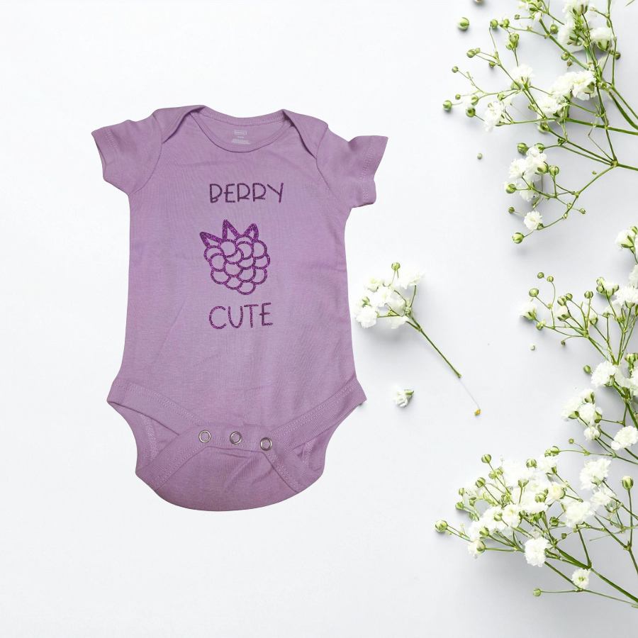 Baby onesie with a saying berry cute with a outline picture of a berry
