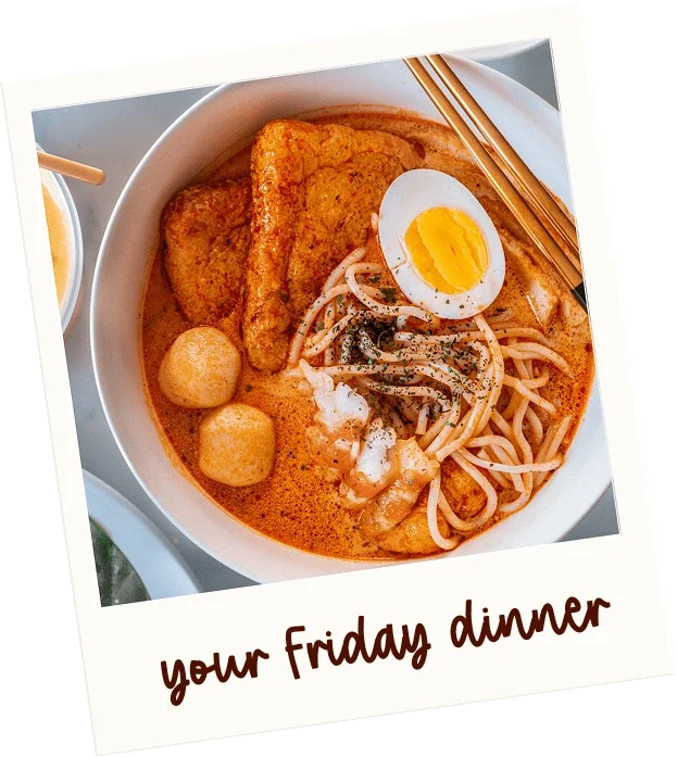 Bowl of ramen with sliced boiled egg, fried tofu, fish balls, bean sprouts, noodles, and chopsticks, with a label that says "your Friday dinner".