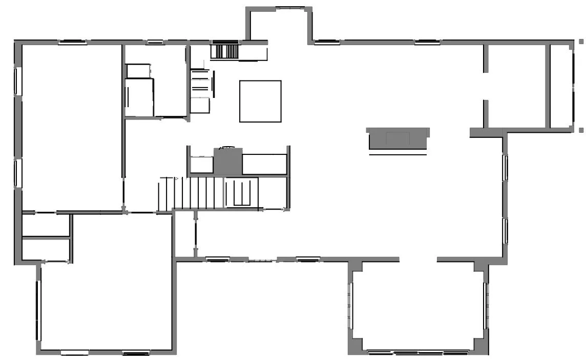 Floor plan of a house with multiple rooms, clearly marked walls, doorways, and staircase.