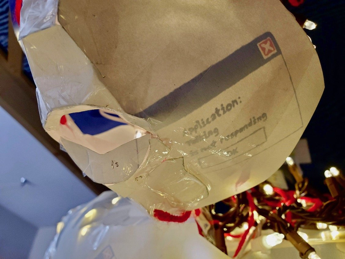 detail of the other side of the face. error message 'application: talking is not responding' is visible
