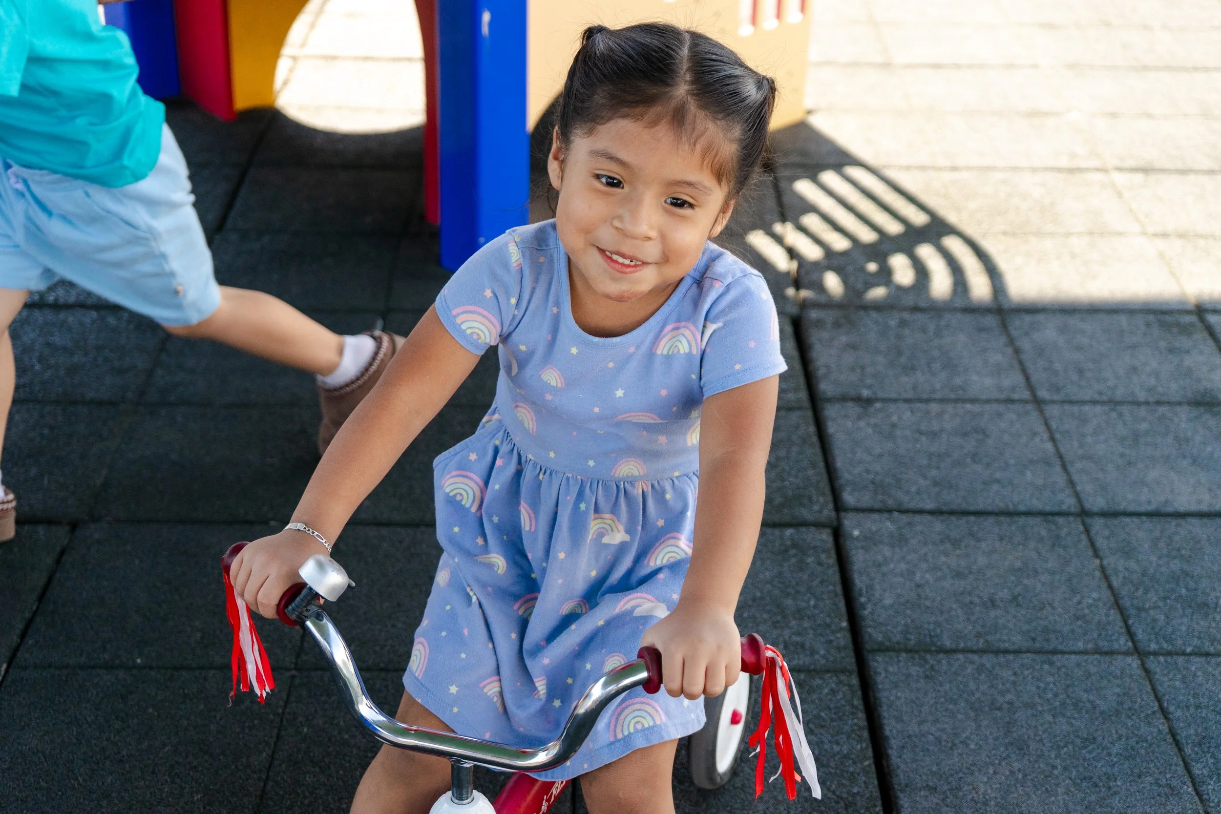 Child-friendly daycare space with age-appropriate toys, learning materials, and open areas that encourage exploration, social development, and hands-on learning.