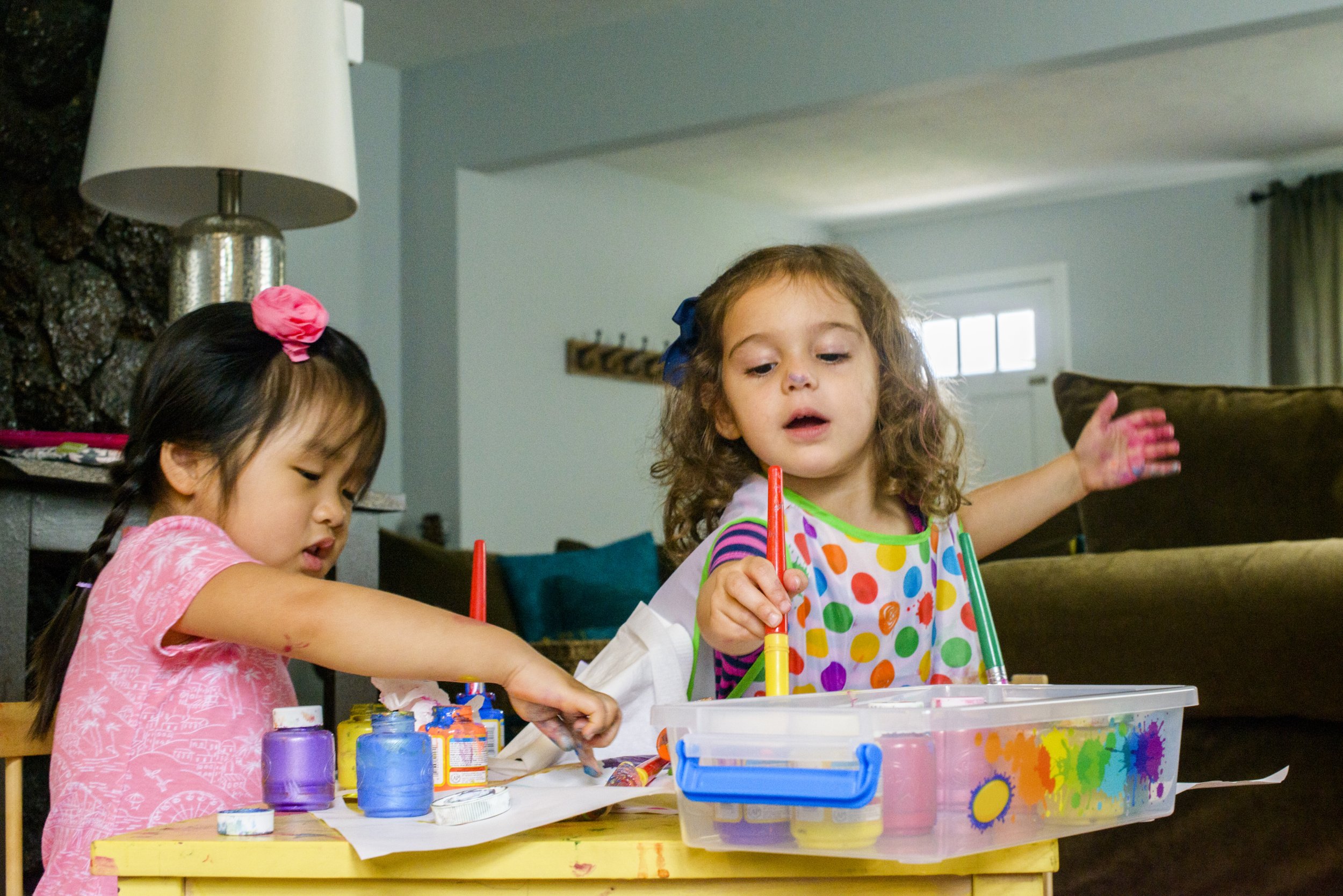 two-young-girls-sitting-at-table-making-art-usin-2025-04-03-14-57-26-utc.jpg