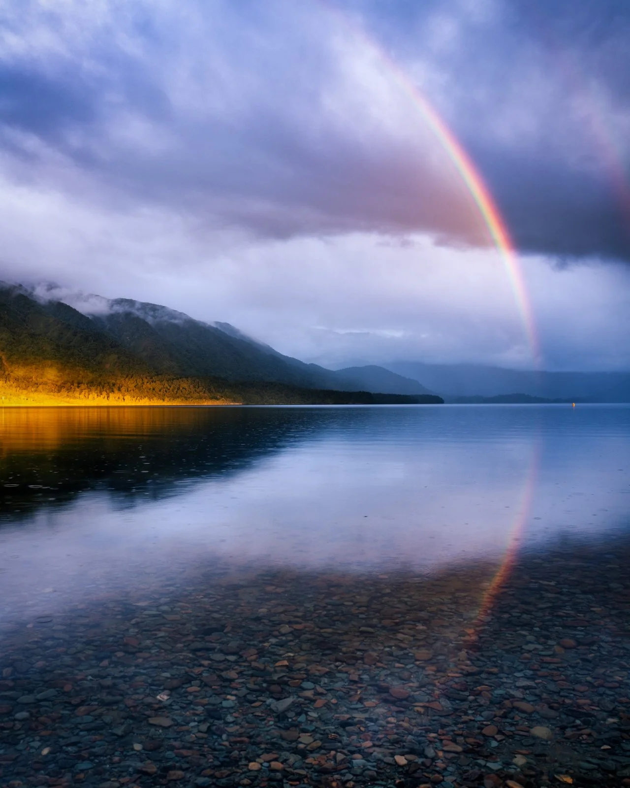 A shaft of light ⚡️ A curtain of rain💧 A rainbow igniting the sky at sunset 🌈

And those moody West Coast mountains doing what they do best - brooding one minute, glowing the next.

This was one of those &ldquo;don&rsquo;t pack up yet&rdquo; evenin
