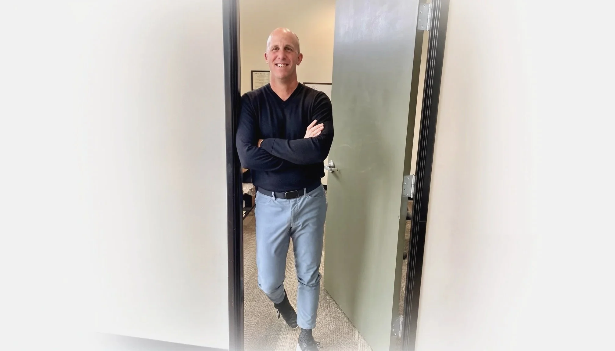 Dr. Seth Gambee, DC, standing in his office in Vancouver, WA, specializing in the Zone Technique and his Peak Protocol to correct posture and eliminate chronic pain.