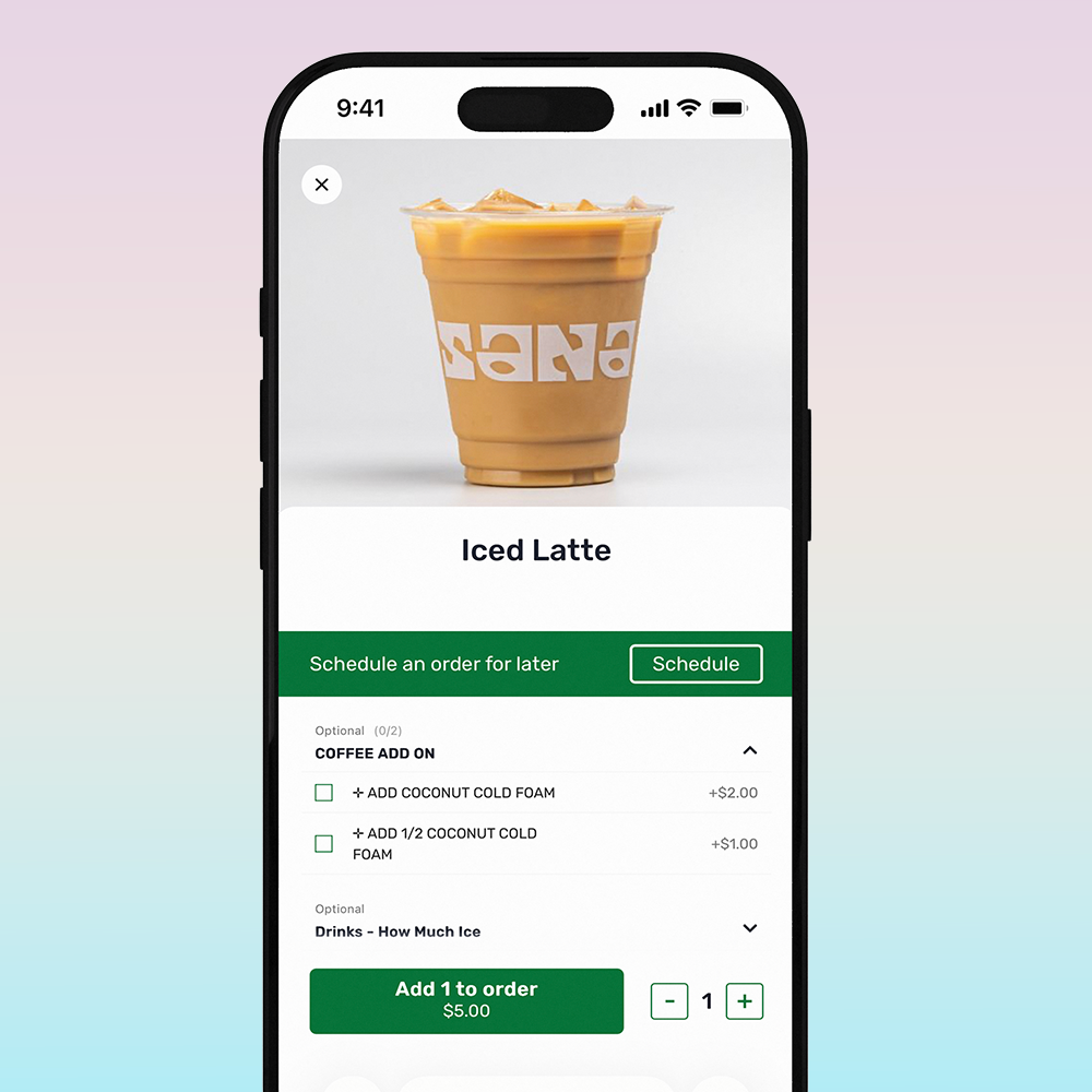 A smartphone screen displaying a mobile app for ordering coffee, showing an iced latte and options to add coconut cold foam and specify ice amount.