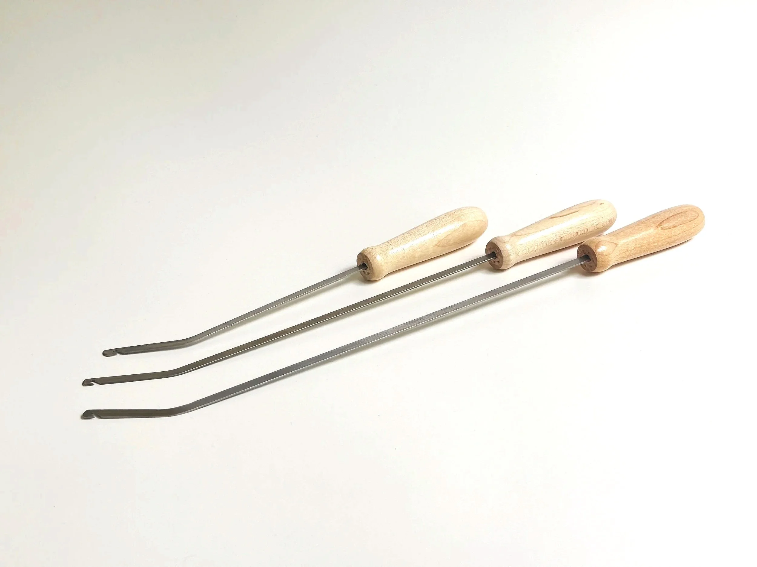 Three Leclerc reed and heddle hooks in different lengths