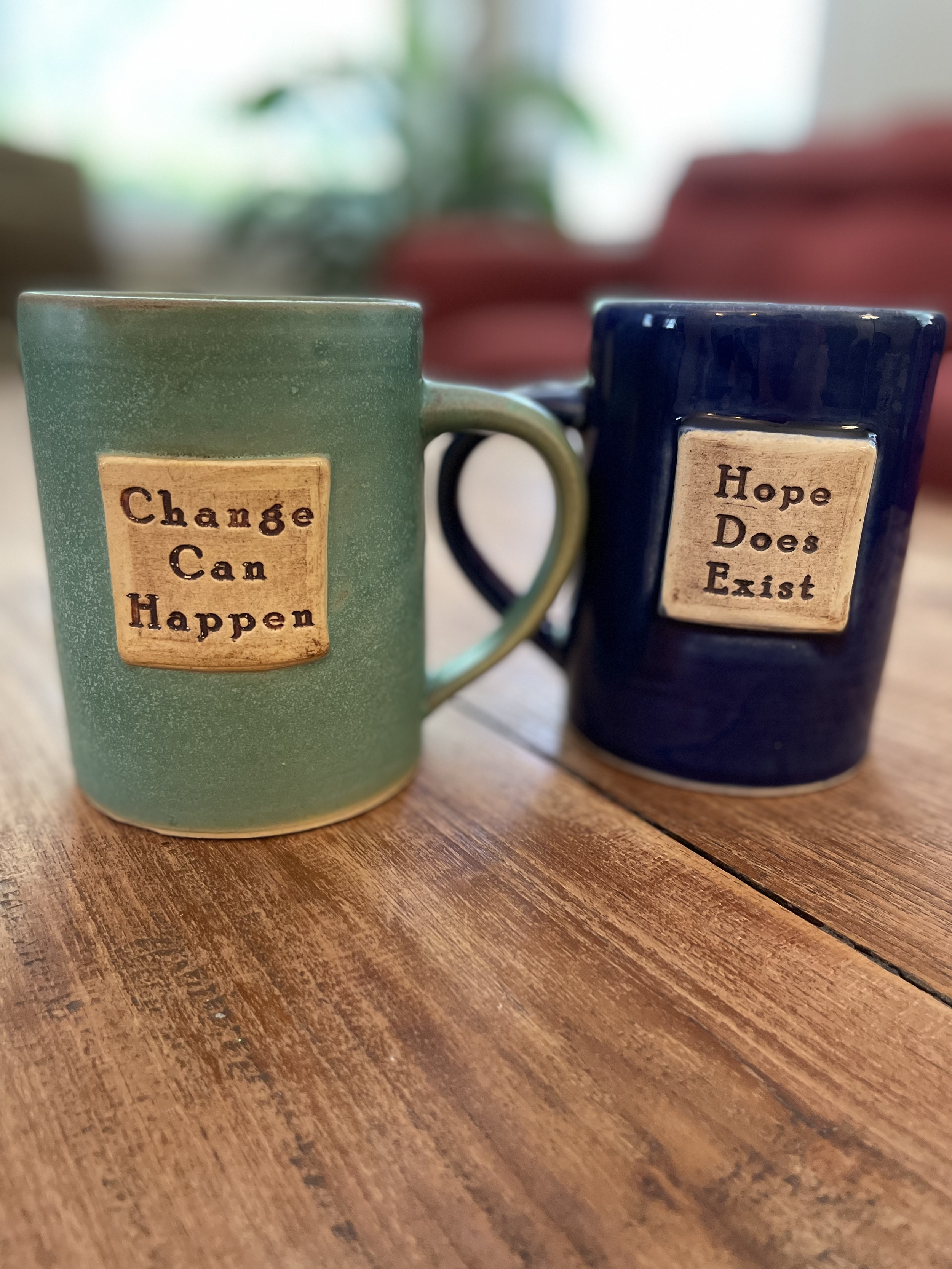 My child, Lindsey, made these mugs. The words come from a mantra I’ve whispered to myself through grief, illness, and healing. They’re part of how I got here. Artist Site: Lindsey M. Dillon 