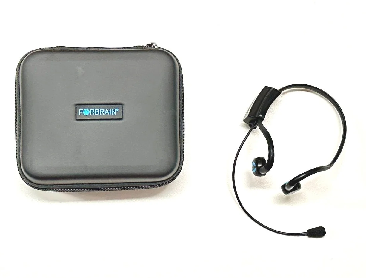 A black case with a label that says 'FORBRAIN' and a black headset with a microphone.