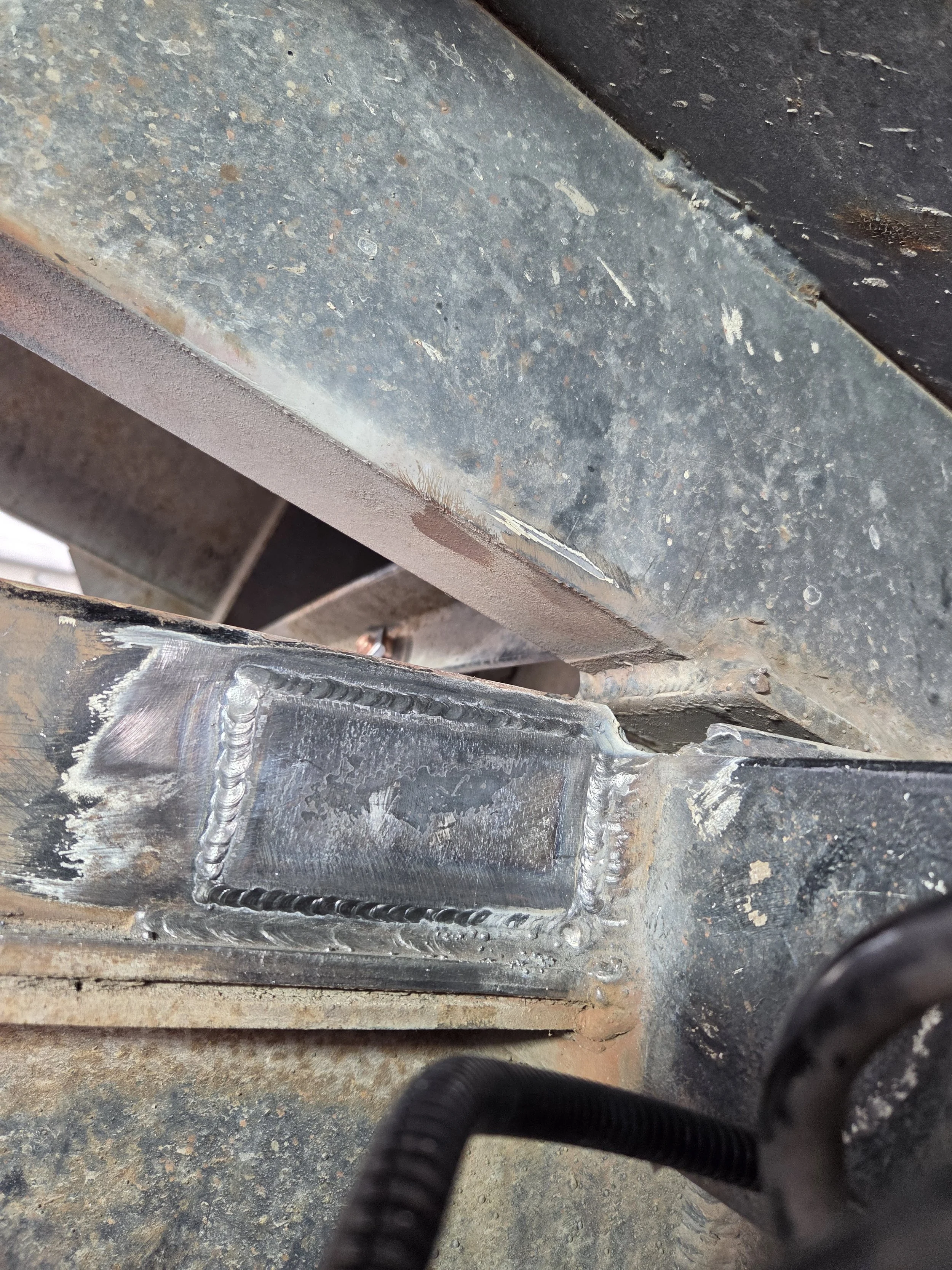 Fish plate welded on the other side of frame.