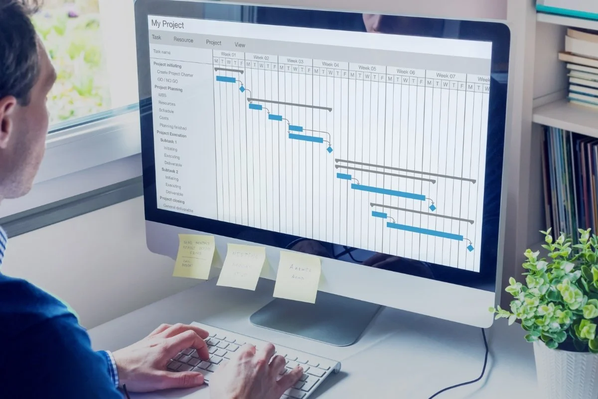 Project planning dashboard with Gantt chart on computer screen, used for managing SME IT projects.