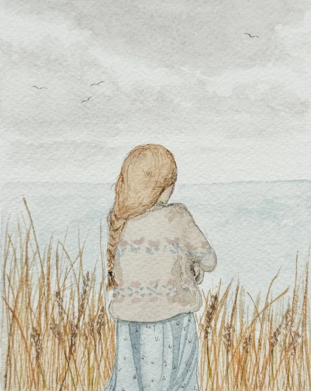 Soft illustration of a child standing in tall grass, gazing out toward the sea under a pale sky.