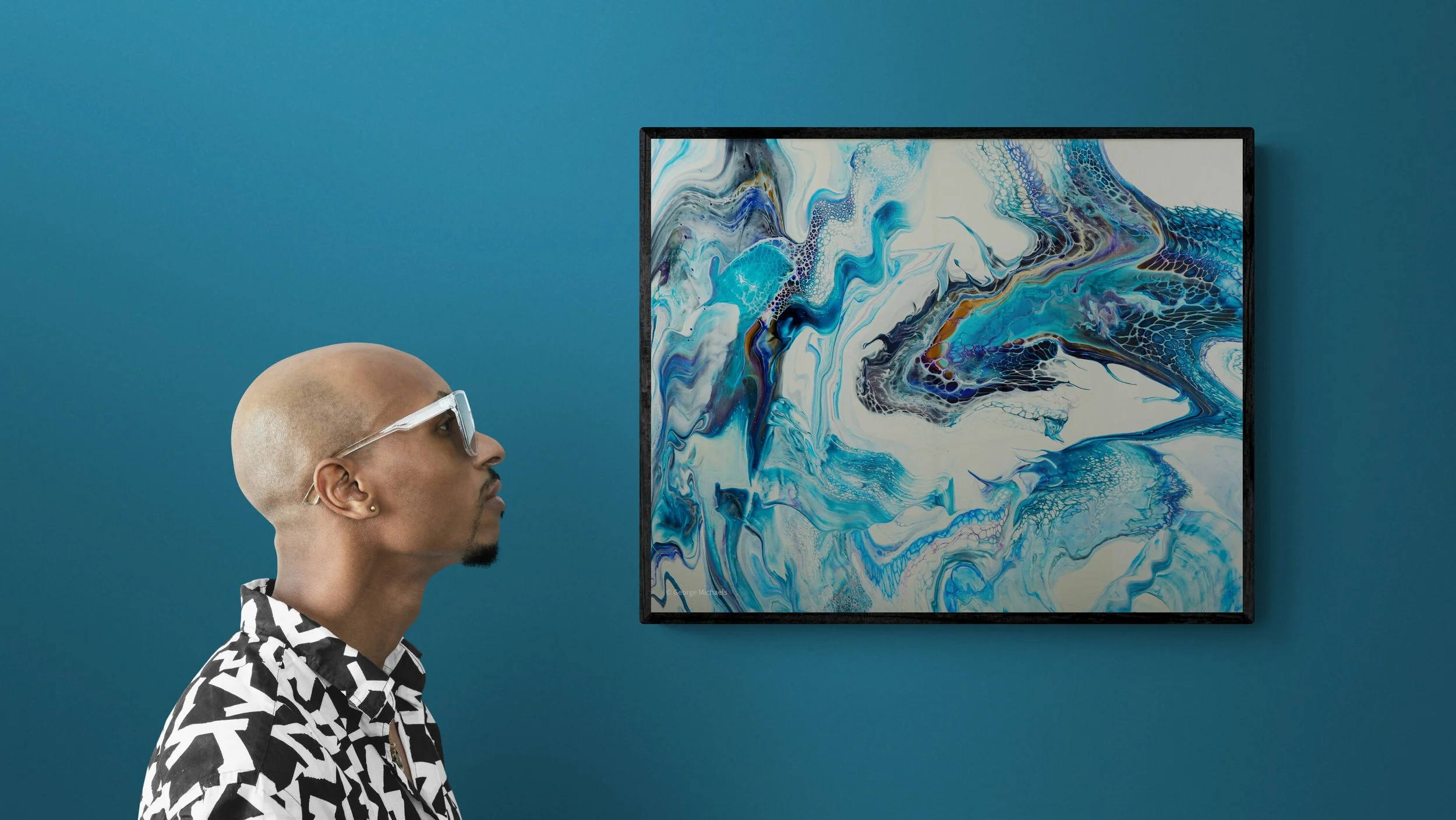 man-standing-next-to-a-gallery-wall.jpg