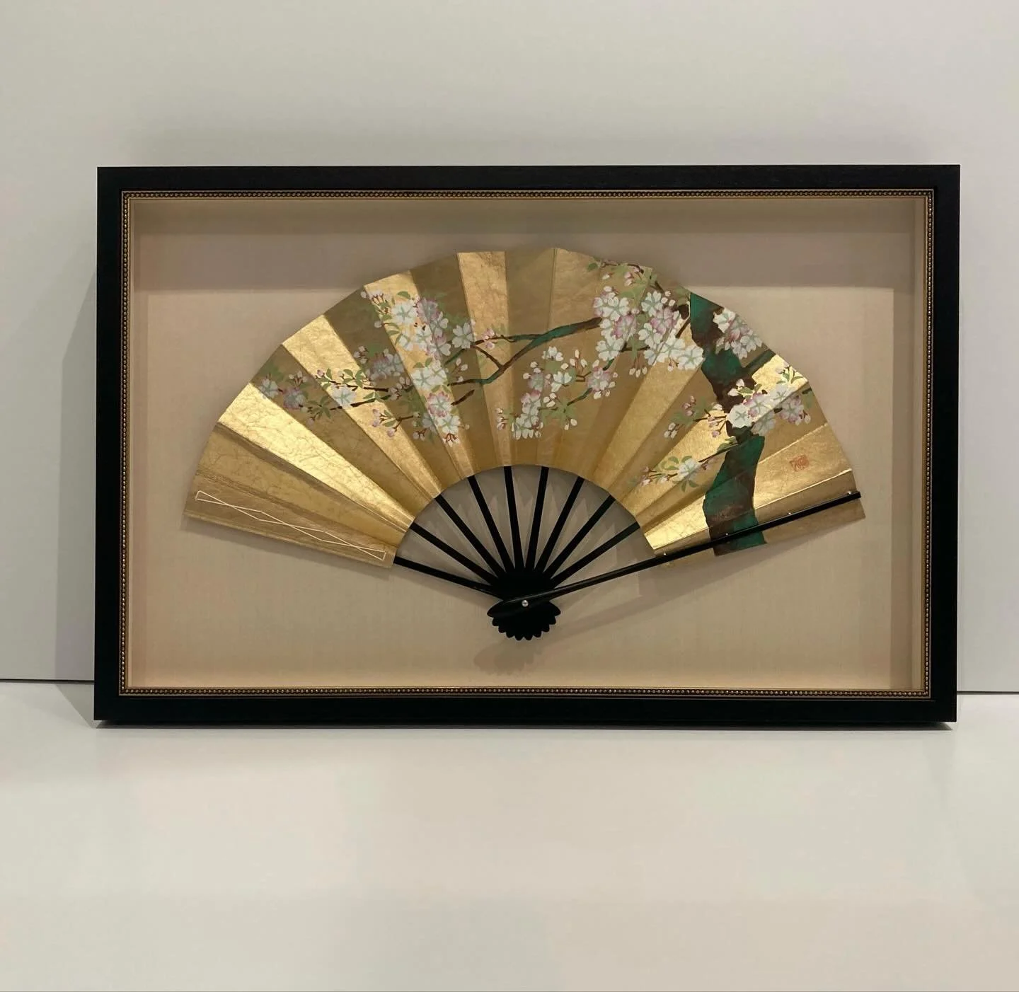 Shadowboxes and be simple or elaborate, elegant or casual.  Here are 2 gold gilded and hand-painted fans being displayed in shadowboxes that are both simple and elegant.  We use a coffee stained walnut stem from Picture Woods and then added a gold be