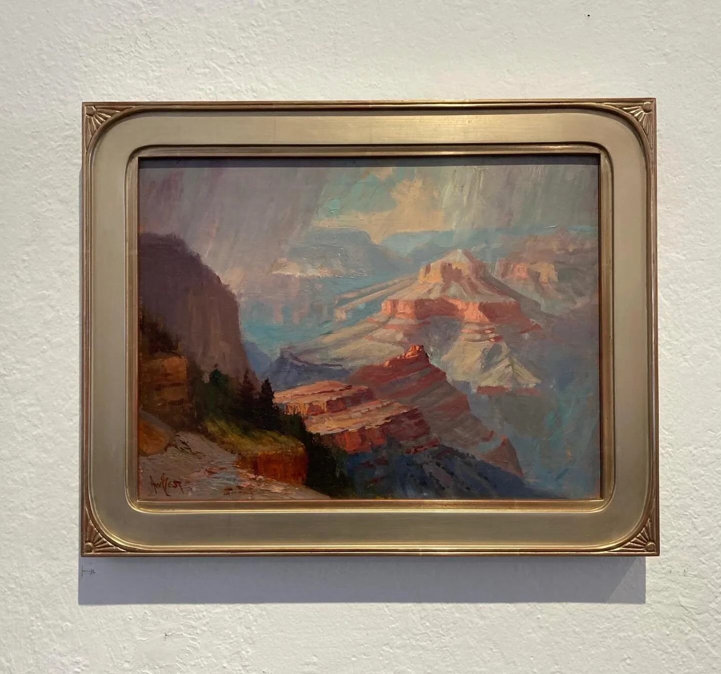 One thing that is really great about handmade frames is that they can be customized for each piece of art.  Here is a 12 carat white gold frame with a good amount of burnishing to let the red of the clay come through.  The corner details feel like ra