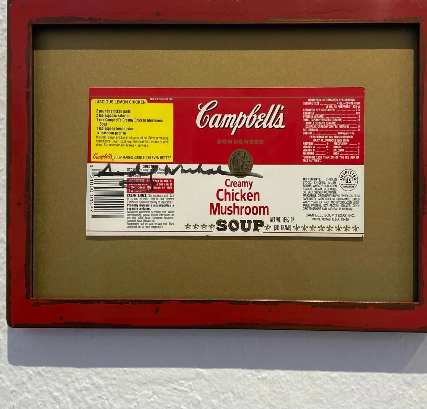 Fun Campbell&rsquo;s Soup label with an authenticated Andy Warhol signature, a great example of the Pop Art movement.  We have floated it on a gold mat and framed it in a rustic red welded steel frame made by Bridger Metal.  I often like framing in t