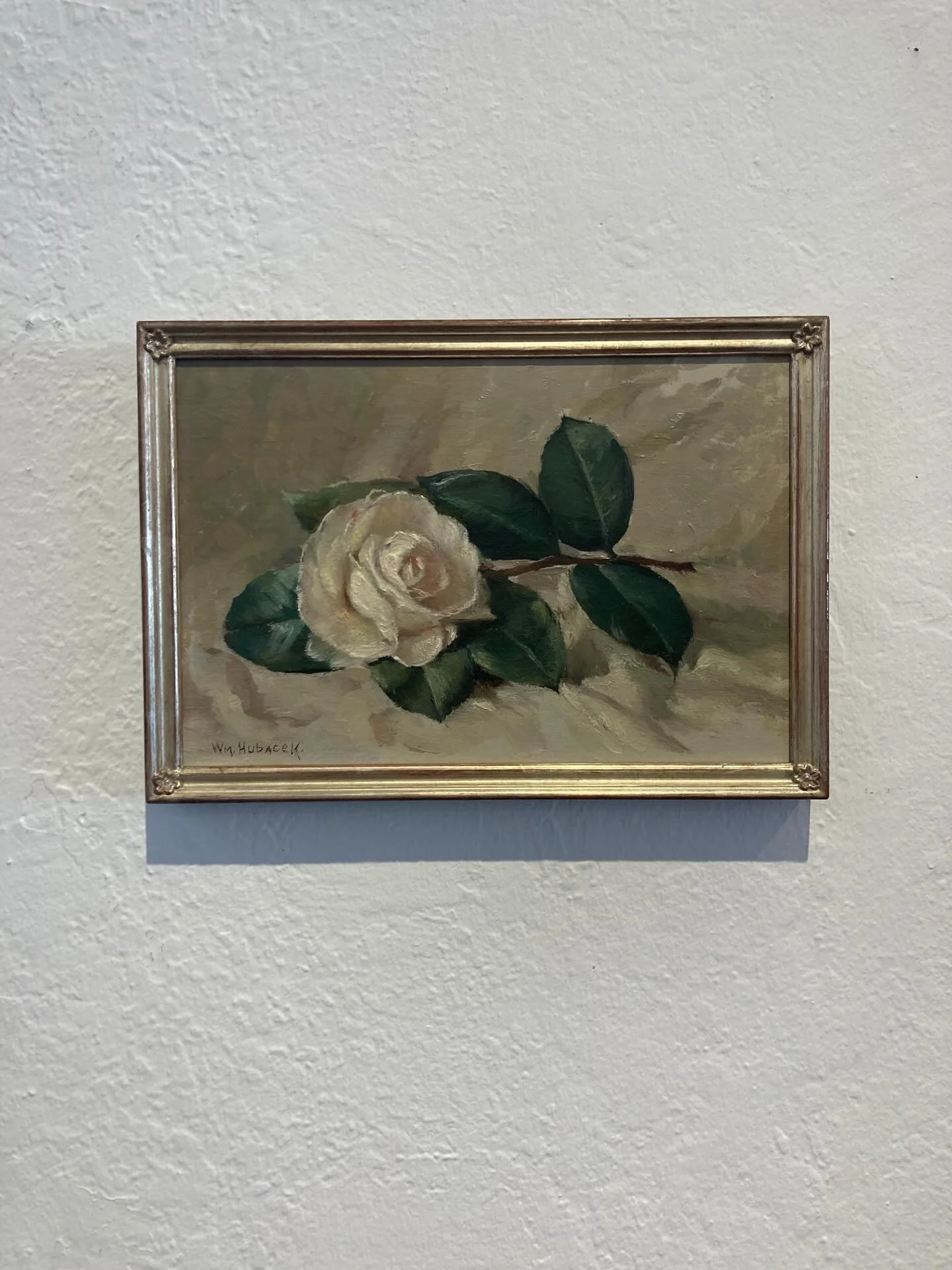 The smallest detail can make a big impact.  We framed this beautiful little painting of a rose by William Hubacek, a still-life and landscape painter based in San Francisco and San Bruno in the early 1900&rsquo;s.  The soft white gold finish with the