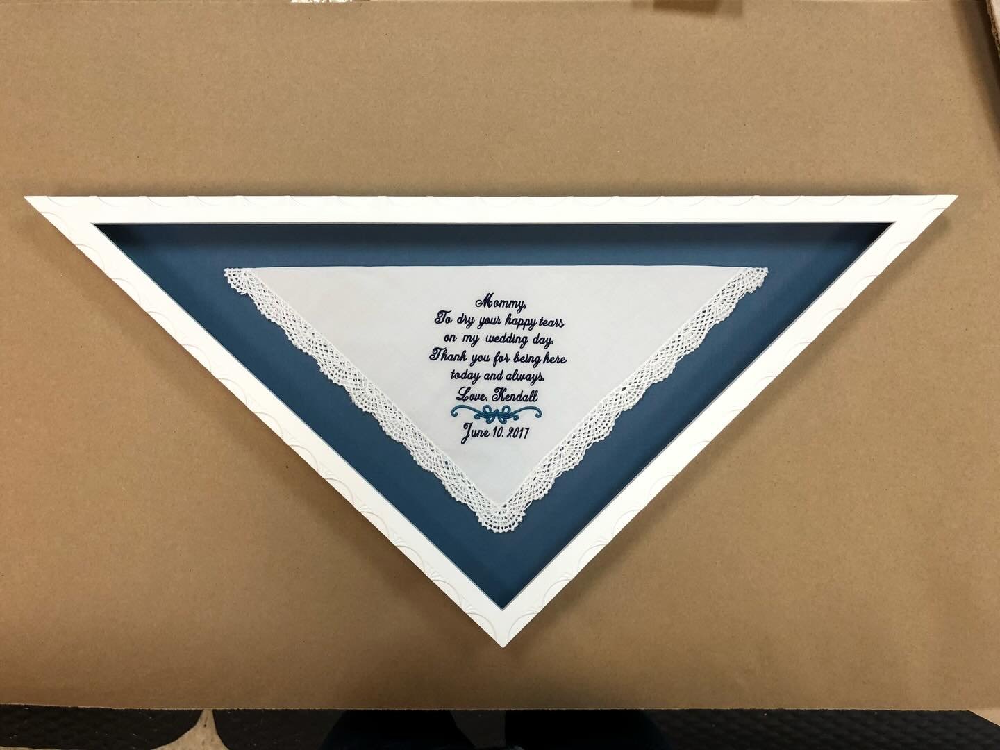 Don&rsquo;t feel limited to a traditional frame shape.  If you have a piece that is an unusual shape, there are many frame makers who can create a frame to fit your special piece.  Here is an embroidered handkerchief that we folded into a triangle an