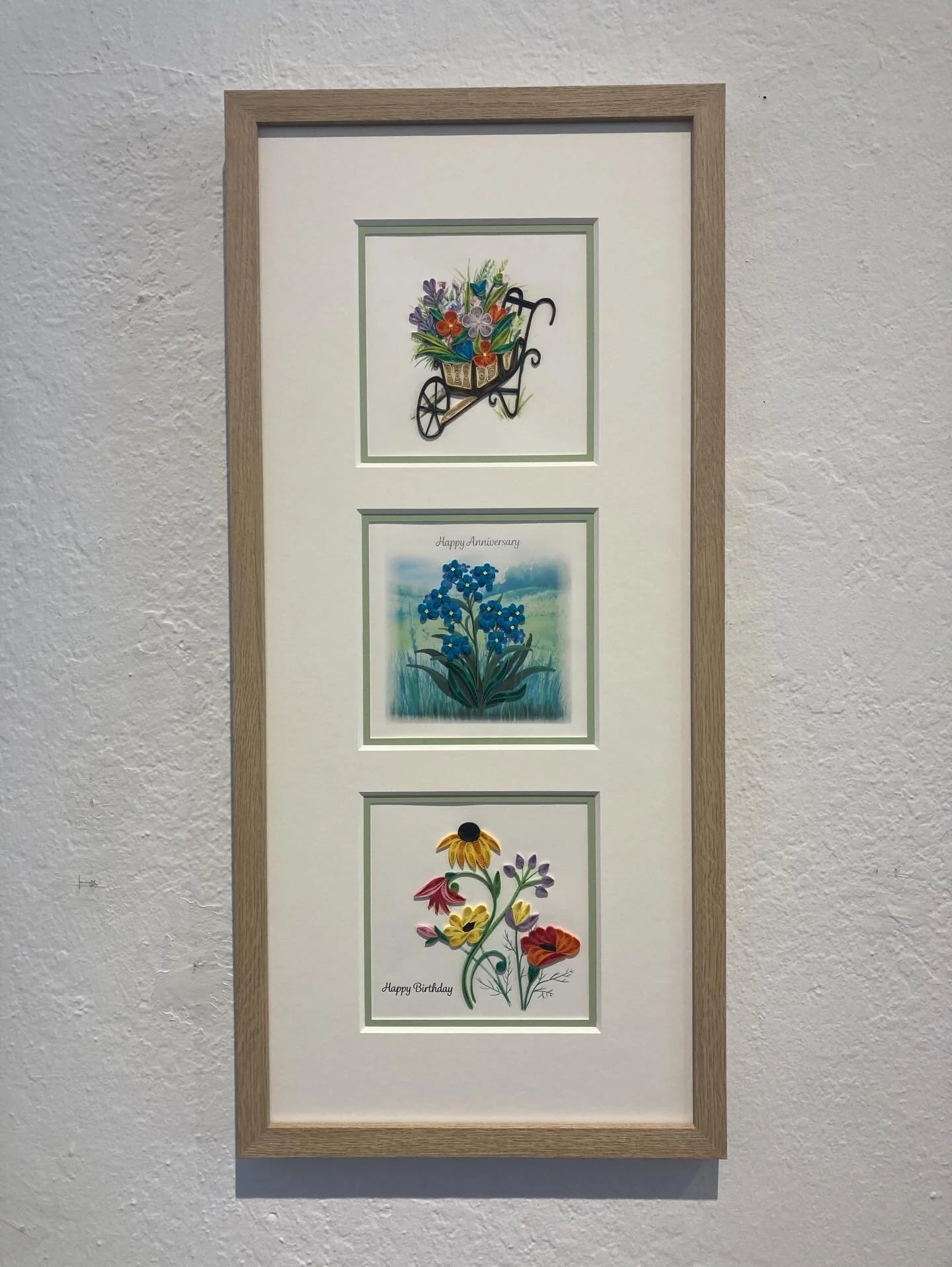 Multiple opening mats are a great way to frame several pieces all in one frame.  Here is a collection of 3 cards with designs made from paper curling.  They are so intricate, you really need to get up close to appreciate all the fine detail and techn